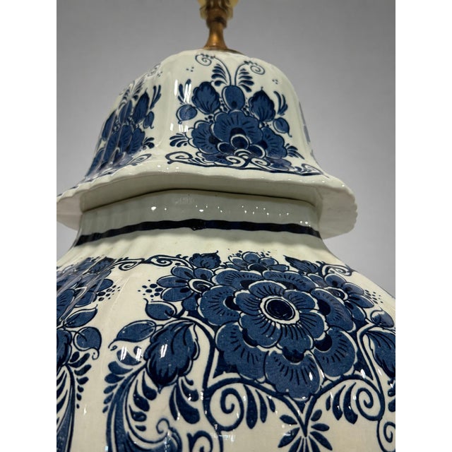 A commanding pair of large blue-and-white covered-jar table lamps, Continental and probably Dutch, dating to the mid-20th...