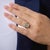 This delicate Edwardian ring showcases a charming arrangement of 12 old mine and rose cut diamonds totaling approximately...