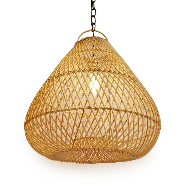 Classic natural rattan Batu drop pendant made from handcrafted traditional weaving techniques with iron wire framing. Each...
