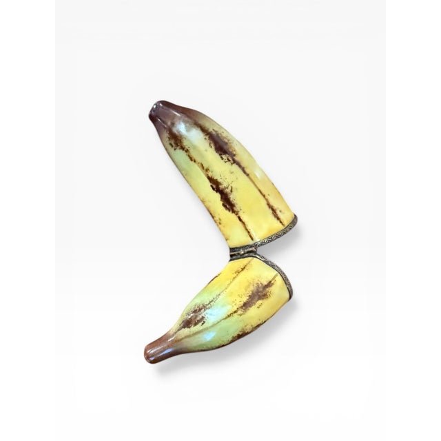 A whimsical and finely executed hand-painted Limoges porcelain trinket box, crafted in France and modeled in the form of a...