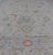Large Modern Oushak with floral design on light blue/gray border with pops of color. Keivan Woven Arts; rug AWR-9004...