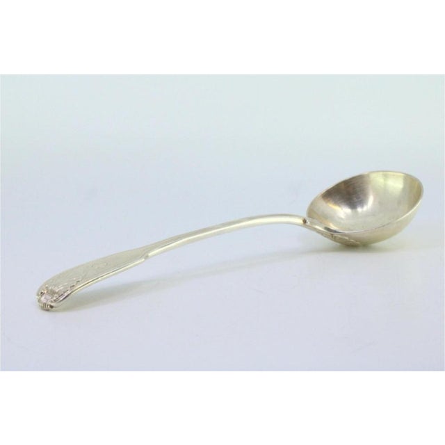 Victorian Silver Sauce Spoon with Embossed Handle, in Very Good conditions. Designed before 1890 This piece has an...