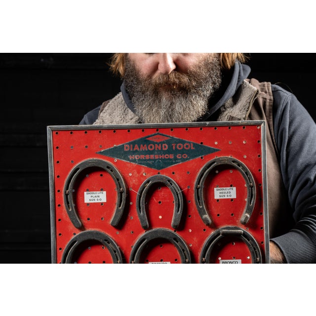 Mid-20th-century point-of-sale horseshoe display produced for the Diamond Tool Horseshoe Co. of Duluth, Minnesota, a...
