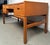 Elevate your workspace with this stunning mid-century teak desk designed by Arne Wahl Iversen, a masterful example of...