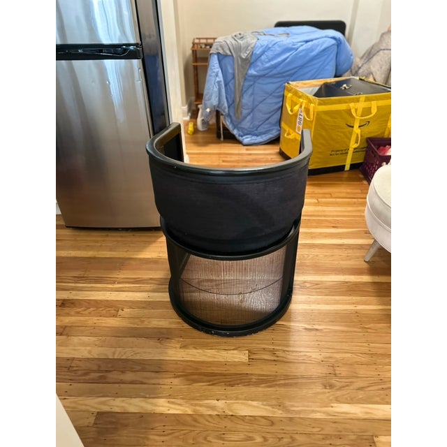 black wood half=circle cylindrical=shape chair with plush black tweed seat and back cushion built-in. Perfect to use as a...