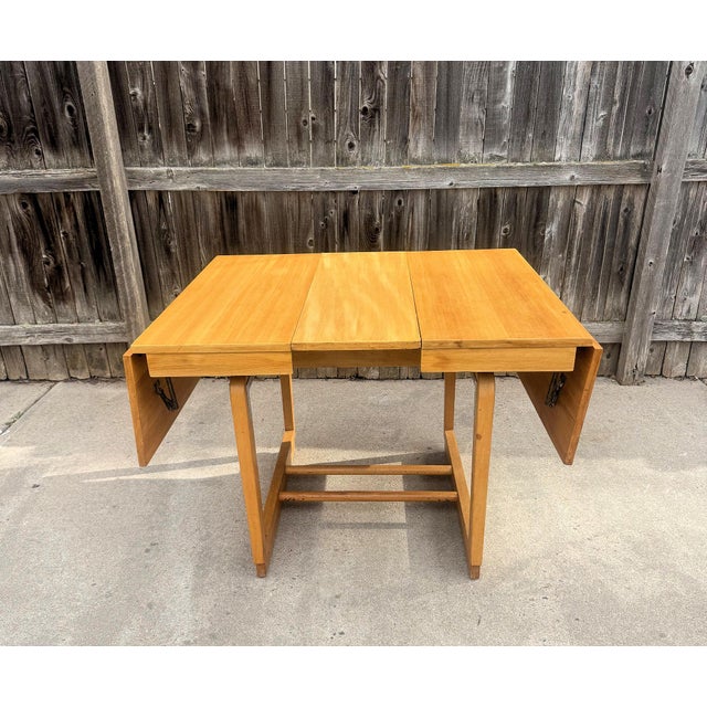 Extension dining table from the original Precedent collection designed by Edward Wormley for Drexel in 1947. Wormley...