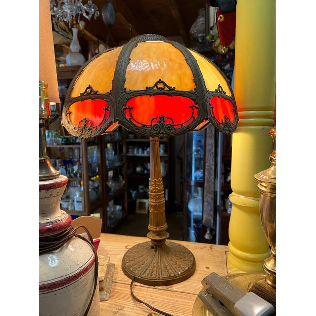Vintage heavy 8 panel Slag glass table lamp. Beautiful 2 tone slag glass shade with metal base. I believe this was...