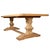 A beautifully crafted trestle dining table made from solid reclaimed wood, showcasing the natural warmth, grain, and...