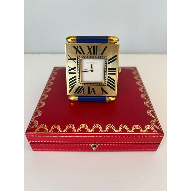 Vintage Cartier “Tank Francaise” Folding Travel Alarm Clock | Paris, Circa 1990 An elegant and timeless vintage Cartier...