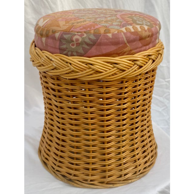 The perfect place to perch! This lovely round wicker stool, in the style of Wicker Works, features oversized braided trim...