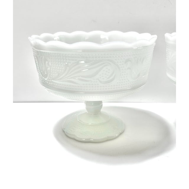 These beautiful milk glass compotes were made by the E.O. Brody company, most likely in the 1940s. They feature scalloped...