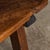 Antique 19th Century Spanish table featuring twisted iron supports and yew wood, boasting an exceptional patina that only...