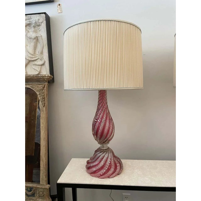 These are an elegant pair of raspberry hue Murano glass lamps with silver foil inclusions throughout. Beautiful swirled...
