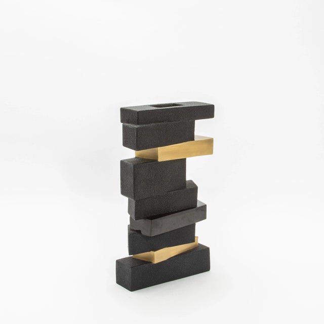 The “Bullion Confection Vase” is bold and sculptural an captivates with its layered geometric design, exuding an artful...