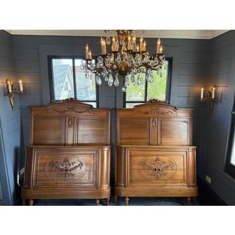Extraordinary Carved Louis XVI Pair of Walnut Twin Beds Pair Rose & Ribbon Motifs — France Step into a quieter, more...