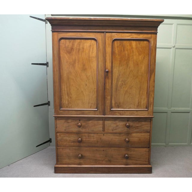 A Victorian Mahogany Linen Press, by Heal’s This is an appealing piece of furniture dating from around 1880 and made by...