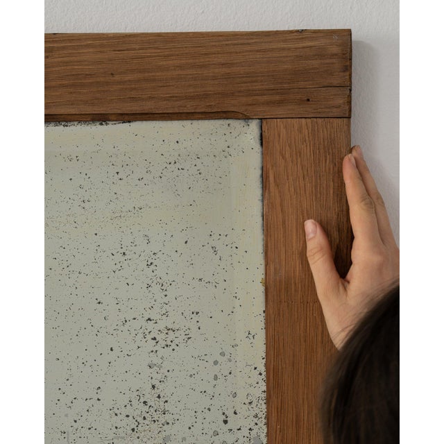 A mirror whose medium honey oak frame, rectangular gives it real character at first glance. Originating in France during...