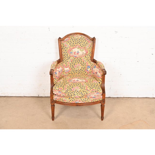 A gorgeous French Regency Louis XVI style bergere armchair or lounge chair In the manner of Baker Furniture USA, Circa...
