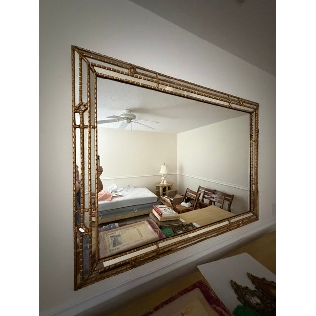 Purchased in the 60’s, this is an intricate gold tone vintage mirror in beautiful condition with a minor flaw visible in...