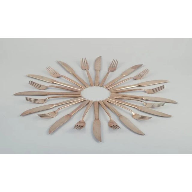 Scandinavian designer. Twelve-person dinner service consisting of twelve dinner knives and twelve dinner forks in...