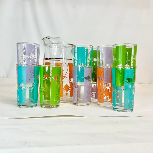 How can you not love these summery colors? This is a great Pitcher with 11 Glasses in lavender, melon, lime green and...