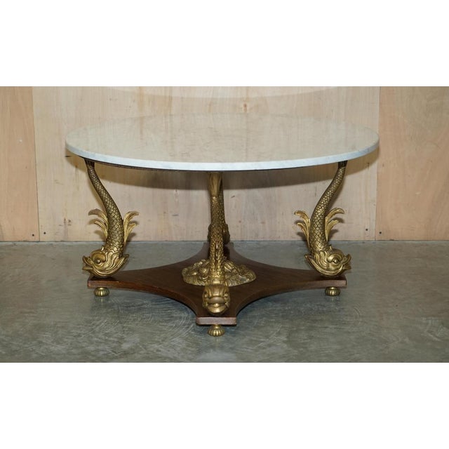We are delighted to offer for sale this important 19th century gilt brass Dolphin base French marble coffee or cocktail...