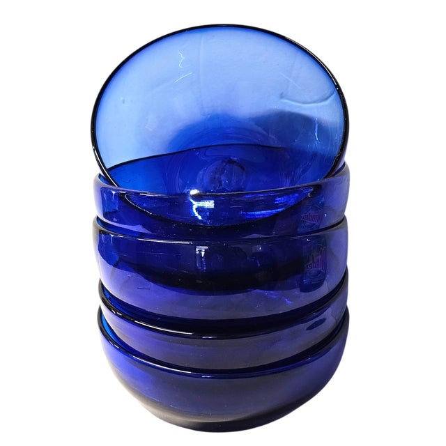 This vibrant set of five handblown cobalt blue glass bowls was crafted for Pottery Barn in Mexico during the late 20th...