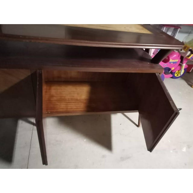 Mid-century double-body bookcase sideboard in the style of ico parisi. The lower section has four closed doors and an open...