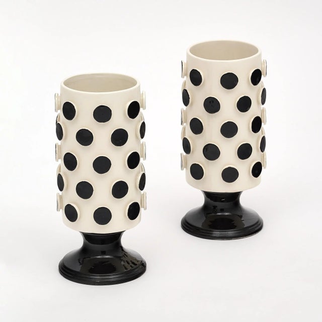 Pair of vases in the Italian Modernist style made of black and white ceramic. This hand-crafted pair is from Verona and...