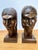Stylized mid-century carved hardwood heads by Silva (likely A. Silva). Angular Art-Deco planes, one with geometric cap,...