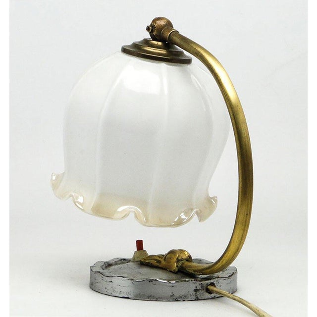 This night lamp comes from Poland in the 1960s. It has a glass shade and a metal mount. It is in very good condition. The...