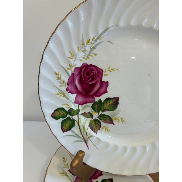 A charming set of three vintage Ridgway Ironstone dinner plates in the Anniversary Rose pattern. Made in England, the...