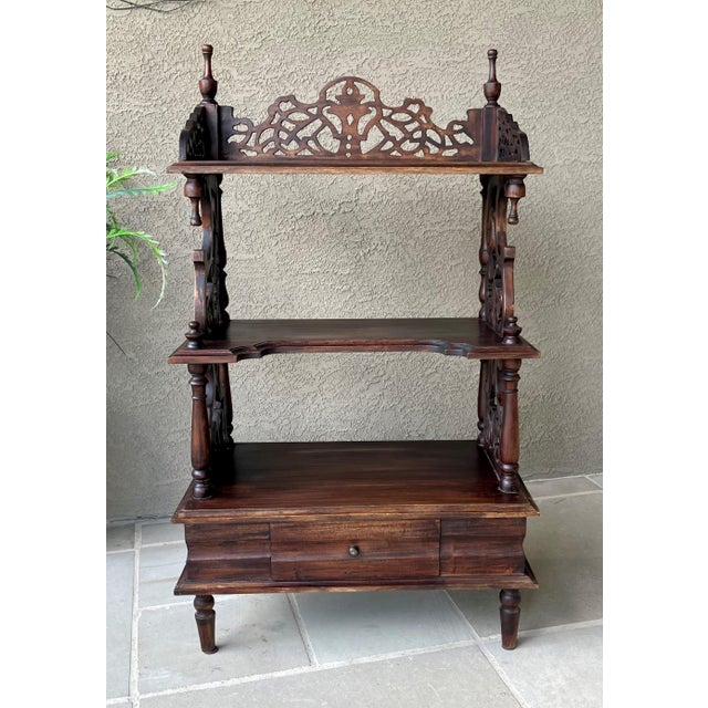 Excellent Pre-Owned Condition. Uniquely charming Victorian Gothic Revival-style three-tier ètagère resting on ring turned...