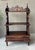 Excellent Pre-Owned Condition. Uniquely charming Victorian Gothic Revival-style three-tier ètagère resting on ring turned...