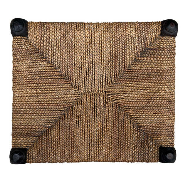 Circa 1940s England. Crafted from solid oak with beautifully turned supports and a handwoven natural rush seat, this...