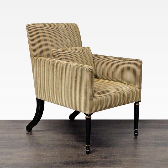 High-end armchair by Dessin Fournir featuring a tall upholstered back, tailored track arms and coordinating lumbar pillow...