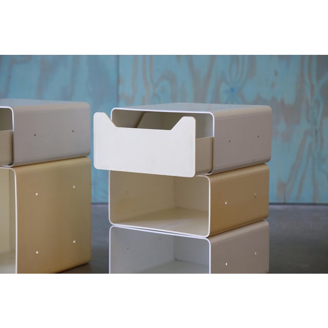 Space age modular units stacked to form nightstands or end tables. Originally made to be part of a modular desk/ shelving...