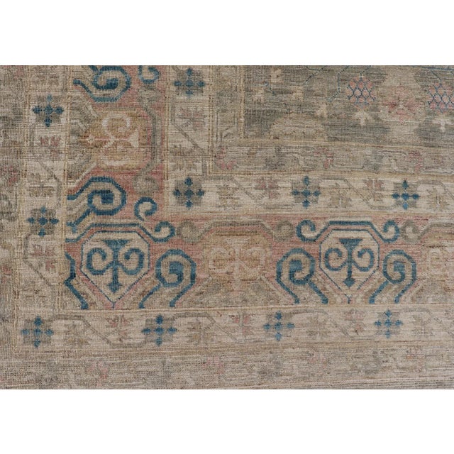 Cream Large Modern Tribal Khotan Rug in Shades of Cream Green Blue and Coral For Sale - Image 8 of 12