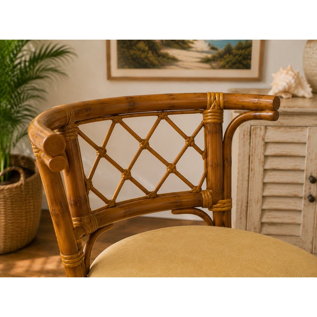 Vintage 1990s Honeymoon-style bamboo and rattan dining set featuring an oval glass-top table and two coordinating barrel-...