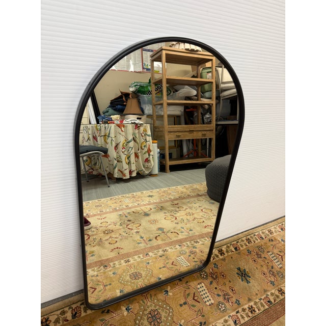 Design Plus Gallery presents the Arched Burnished Brass Mirror from Rejuvenation. The mirror has a sleek brass metal frame...