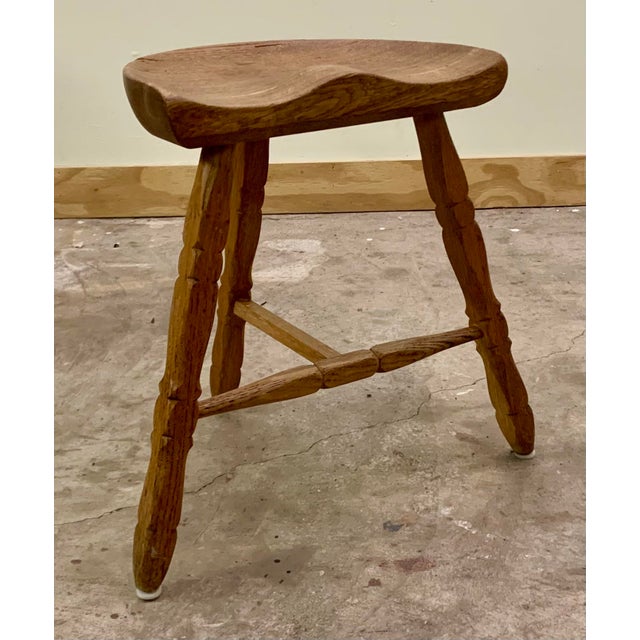 Hand sculpted seat on turned elegant legs.Unsigned