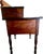 Charming provincial Pennsylvania work table designed in a Sheraton style. The two-tiered piece is made from cherry wood...