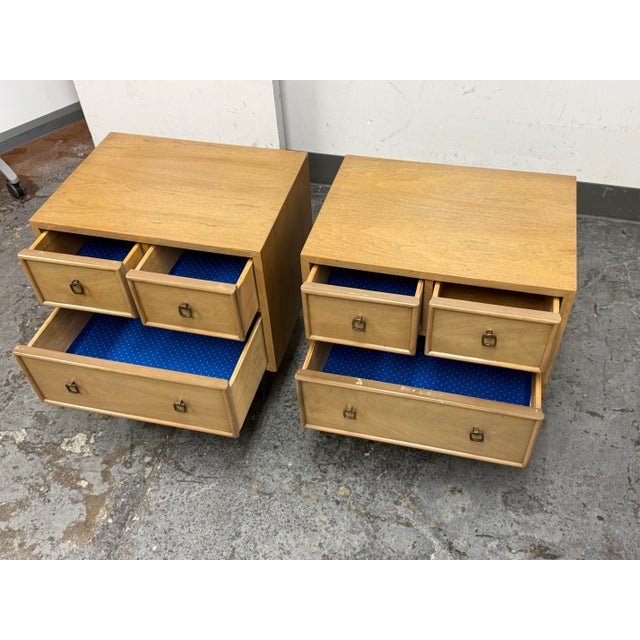 Design Plus Gallery presents a Pair of Blonde Walnut Nightstands by American of Martinsville from the Late 20th Century....