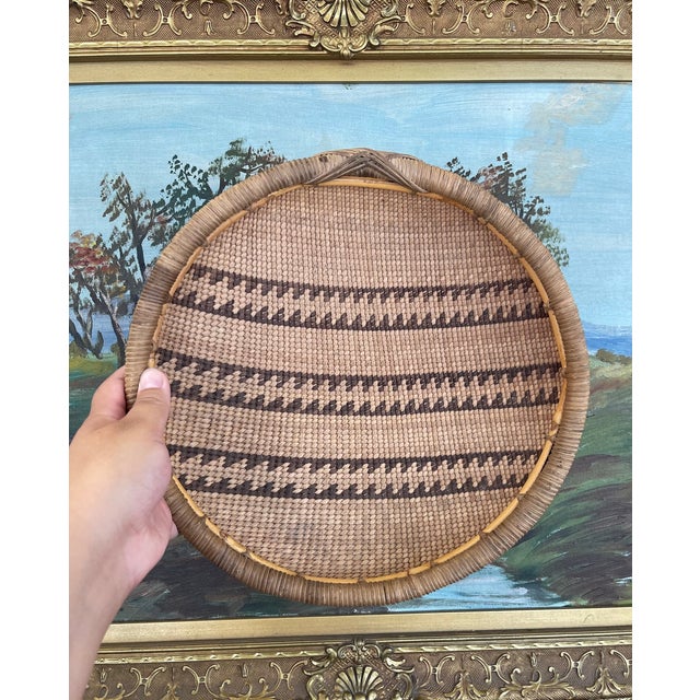 This finely woven likely Native American basketry bowl is a striking example of early 20th-century Mission basketry,...