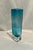 A Mid-Century era square blue decorative vase standing 9” h x 2.75” square. This vintage vase is a stunning accent piece...