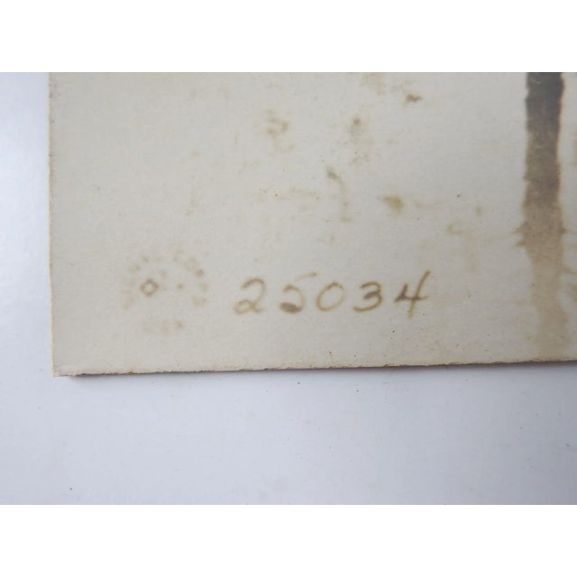 Vintage circa 1918 US Army WWI Signal Corpssilver gelatin photograph. Silhouette image of soldiers working on a road or...