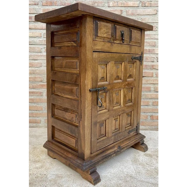 from Northern Spain, constructed of solid walnut, the rectangular top with molded edge atop a conforming case housing one...