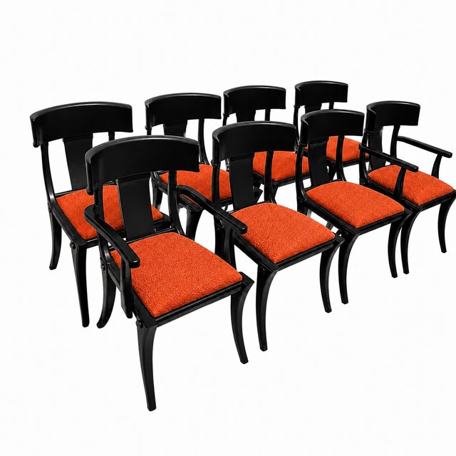 Modern set of Klismos style dining chairs. The set consists of 6 armless and 2 captains chairs. The chairs are well made...