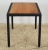 Handcrafted rectangle shaped side table made of a cherry wood top and a black finish steel frame. This piece was...