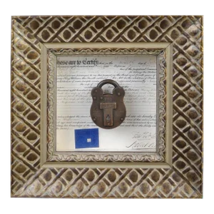 A Shadowbox Featuring a 'Squire 770' Brass Padlock
